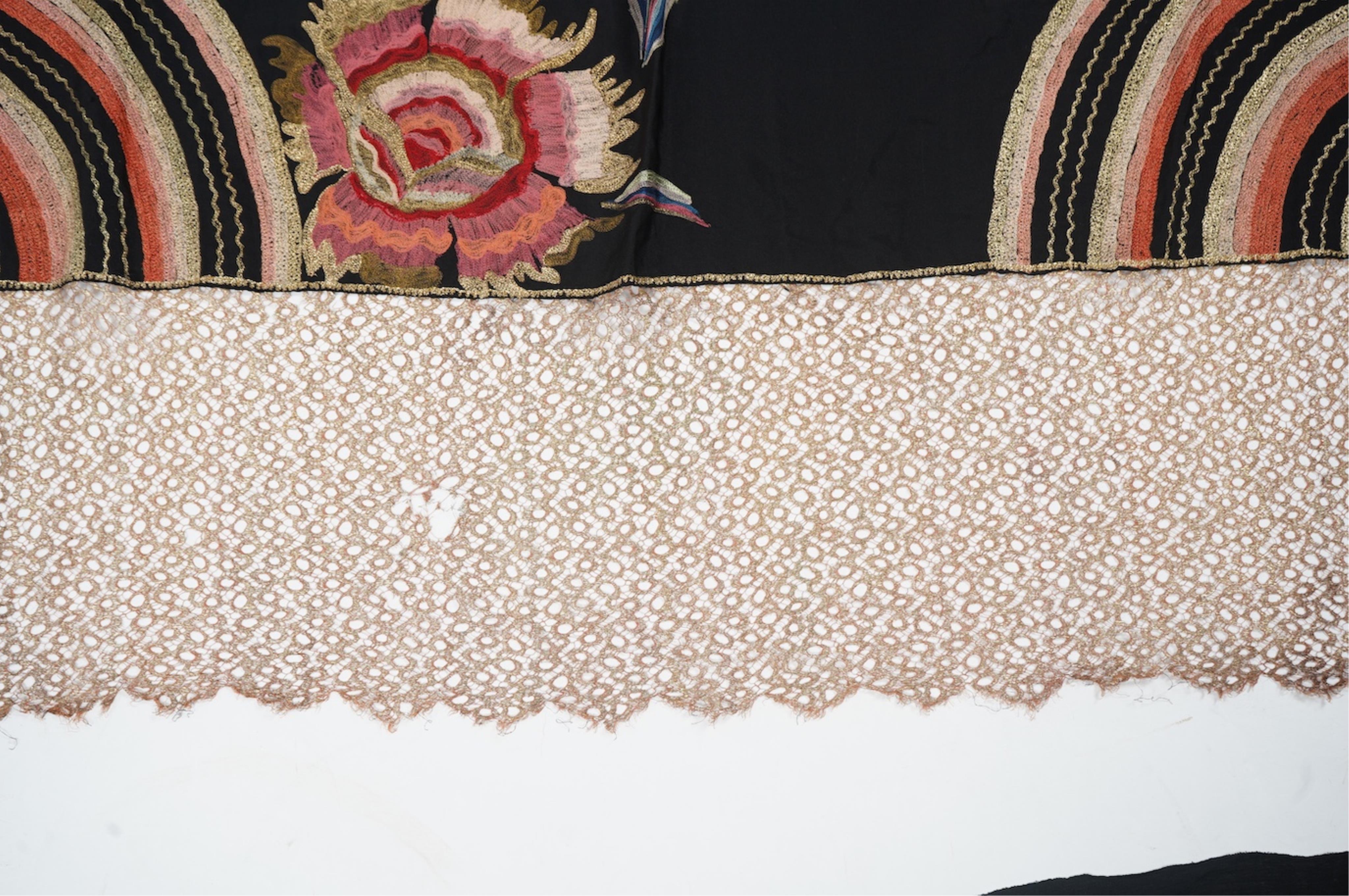 An Art Deco black silk floral embroidered shawl, using tones of red and orange with gold highlights, bordered with bronze metallic lace, together with a black crepe and yellow silk embroidered stole. Art Deco stole, 142c
